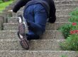 A woman slips on a staircase and fell down. a woman falling down a staircase